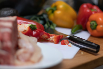 Chopped bell pepper and knife next to it