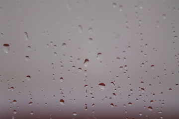 Raindrops on the window. white tone