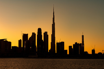 Fototapeta na wymiar Silhouette of Dubai cityscape with Burj Khalifa at Magic Hour