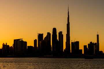 Fototapeta na wymiar Silhouette of Dubai cityscape at Magic Hour