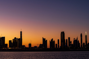 Fototapeta na wymiar Silhouette of Dubai cityscape at Magic Hour