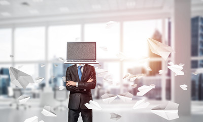 Businessman with laptop instead of head.
