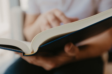 Young man reading a book