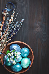 Happy Easter. Congratulatory easter background. Easter eggs and flowers. Background with copy space. Selective focus.