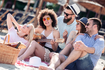 Friends having fun on the beach