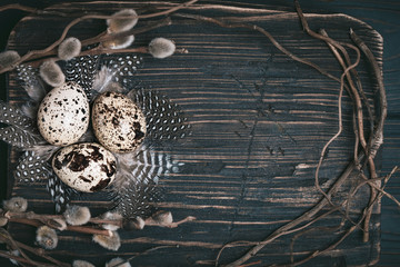Fototapeta na wymiar Quail eggs on old wooden background. Happy Easter. Top view. Free copy space. Selective focus.