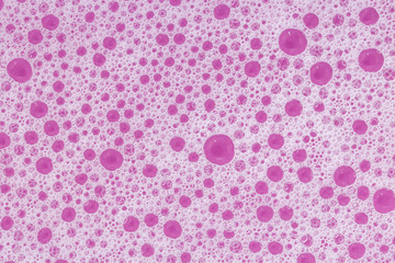 Abstract colorful backgrounds of soap foam or wash powder bubbles. Close-up