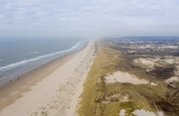 Deurstickers Noordzee, Nederland Dutch dunes by the sea from above in mystical late afternoon sun
