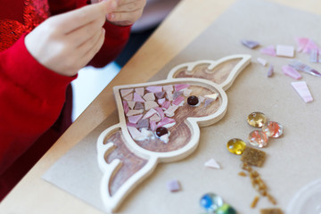 The process of stroking the heart from a mosaic.