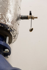 Drain valve for heat-insulated piping.