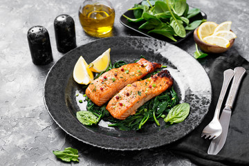 Salmon fillet with spinach .