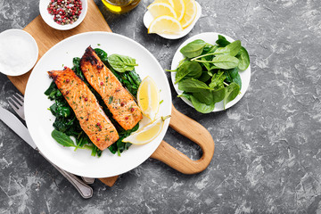 Salmon fillet with spinach .