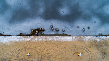 Lake Basin Angle, beach, ice. Ukraine, Rivne region, Aerial drone view