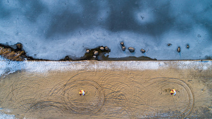 Lake Basin Angle, beach, ice. Ukraine, Rivne region, Aerial drone view