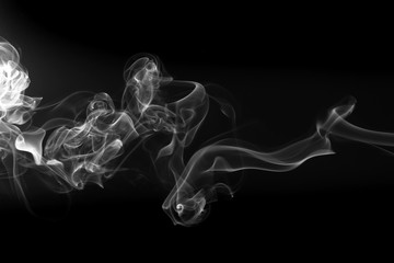 Movement of white smoke on black background