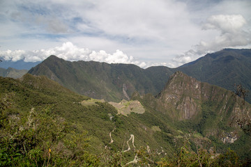 Naklejka premium Machu Picchu and Huayna Picchu mountain in Peru, seen from the door of the sun