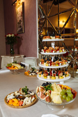 Variety assortment of different luxury food snacks and appetizers, concept of decorated catering banquet set, on a party event celebration