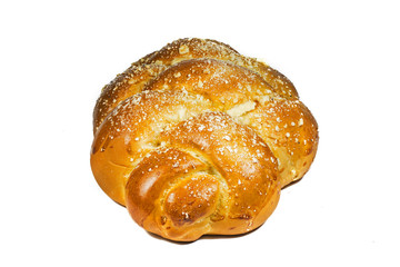 Challah bun isolated on white background, view from the side.