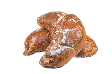 two buns-croissants sprinkled with sugar powdered isolate on a white background, side view