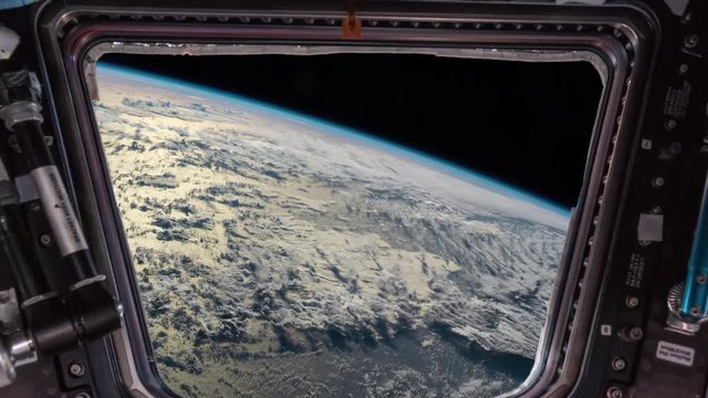 Earth as seen through window of International Space Station ISS . Elements of this image furnished by NASA. I