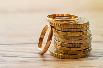 wedding rings on steel and coins