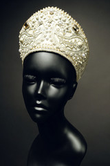 Mannequin head  in creative Russian white kokoshnick with jewels and pearls