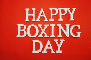 Fototapeta na wymiar Happy Boxing Day alphabet letters on red background
