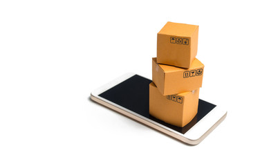 A stack of boxes on a smartphone. Online shopping concept. Shopping through the mobile app. Goods and services, e-commerce. Online retail. Marketing. Non-cash and contactless payment by phone.