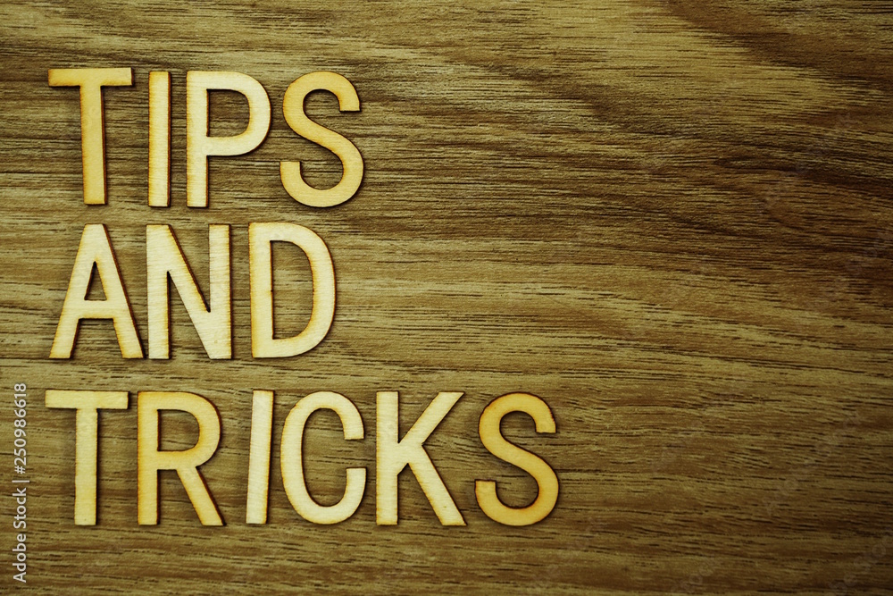 Poster tips and tricks text message on wooden background