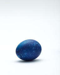 Decorated Blue Easter egg on white background
