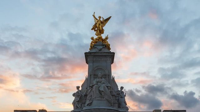 Victoria Memorial Sunset Evening Time-Lapse with the Buckingham Palace in the background.  Blue sky with yellow clouds sunset.