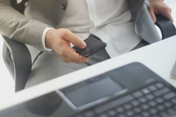 Businessmen use smartphone desk. The marketing concept in the new era