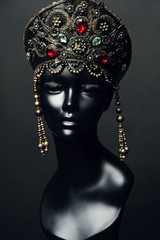 Black  mannequin head in creative metal kokoshnick with jewels