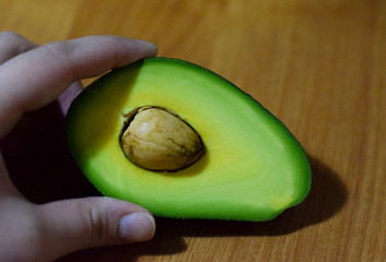 avocado in hand