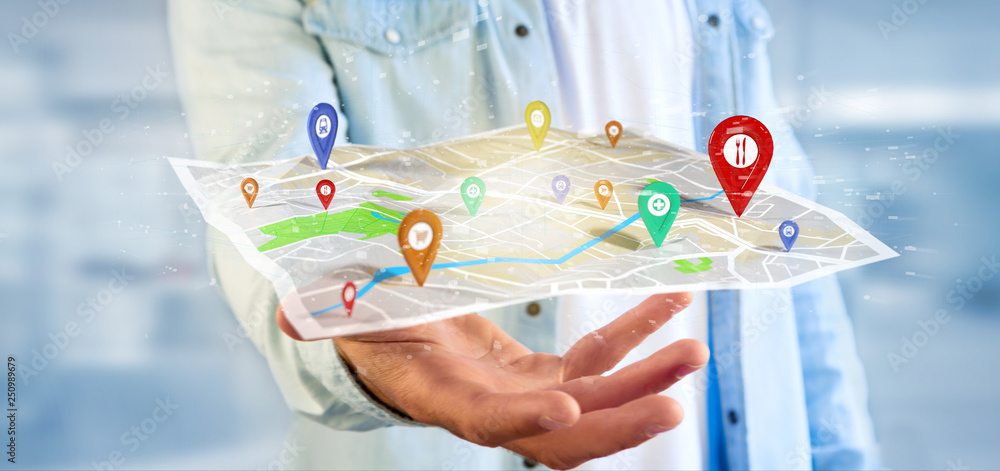 Poster man holding a 3d rendering pin holder on a map