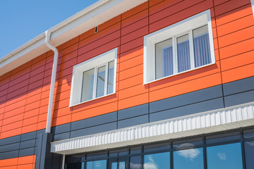 Modern architecture. Modernized house with an orange facade.