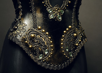 Gorgeous golden corset with precious stones