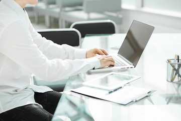 close up.businessman working on laptop in modern office