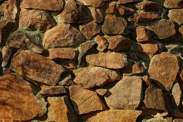 brown cobble stone texture in a fence wall