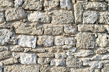 Old relief ecru limestone wall