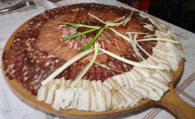 Lukanka is a Bulgarian salami unique to Bulgarian cuisine. Lukanka is semi-dried, has a flattened cylindrical shape, and brownish-red interior in a skin that is normally covered with a white fungus