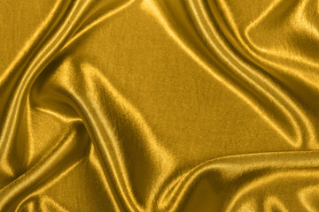 Gold luxury satin fabric texture for background and art design