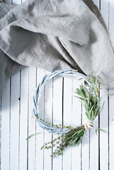 rustic wreath from lavender and thyme leaves on gray cloth