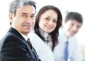 closeup. senior businessman sitting at a meeting