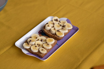 banana toast with peanut butter, cocoa nibs and honey