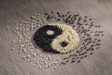 Black and white seed sesame. Yin Yang sign. Concept healthy eating, organic food. Tai Chi