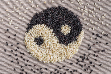 Black and white seed sesame. Yin Yang sign. Concept healthy eating, organic food. Tai Chi
