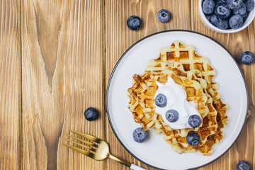 Fresh homemade waffles with blueberries for breakfast