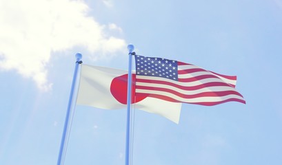Japan and USA, two flags waving against blue sky. 3d image