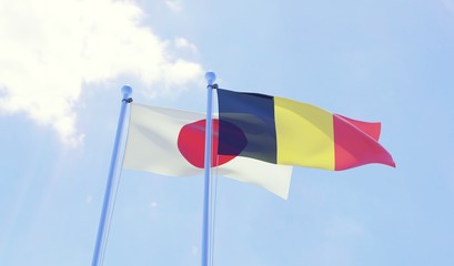 Japan and Belgium, two flags waving against blue sky. 3d image